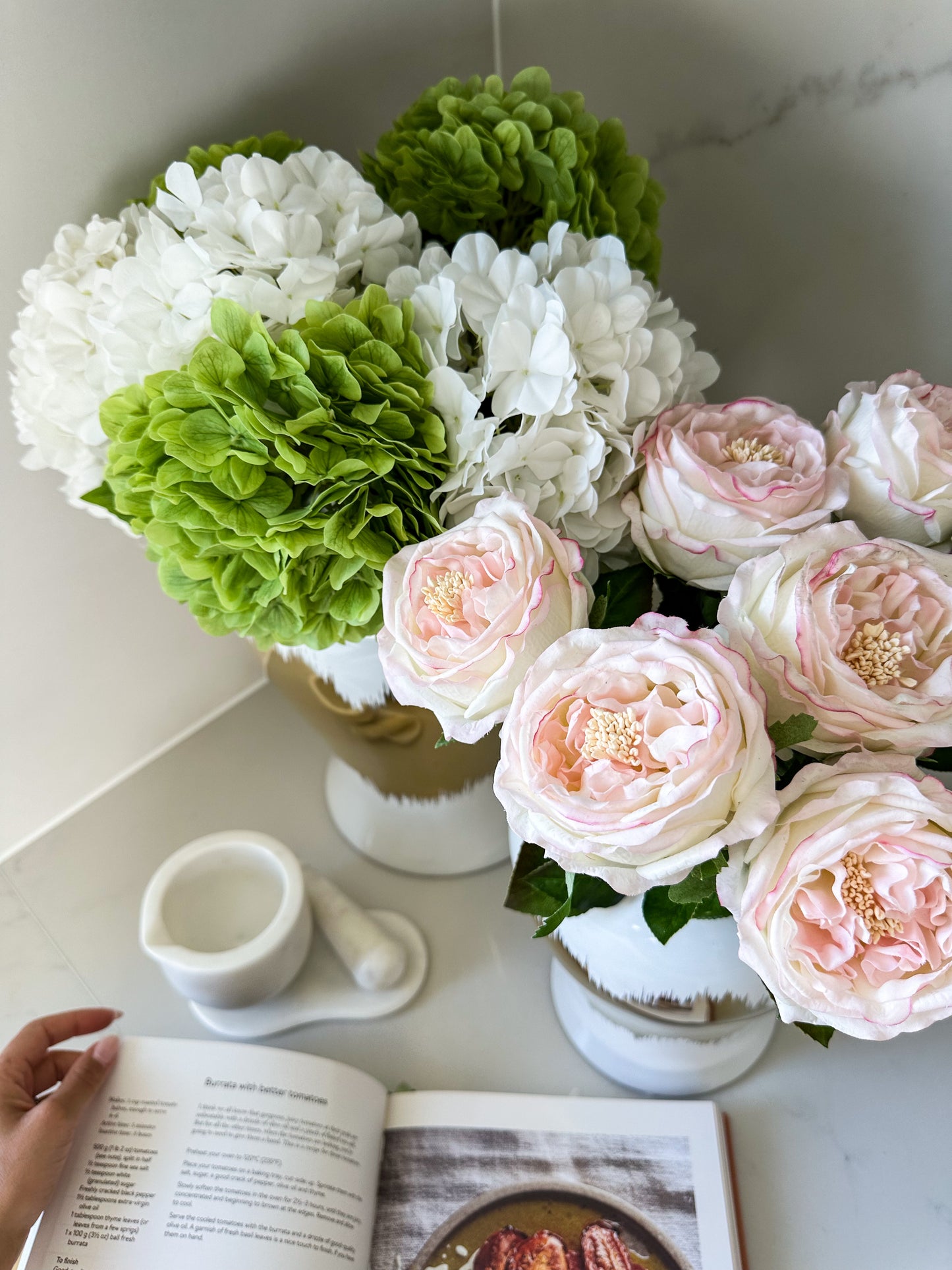 top view of assortment of real touch flowers; hydrangeas and peonies