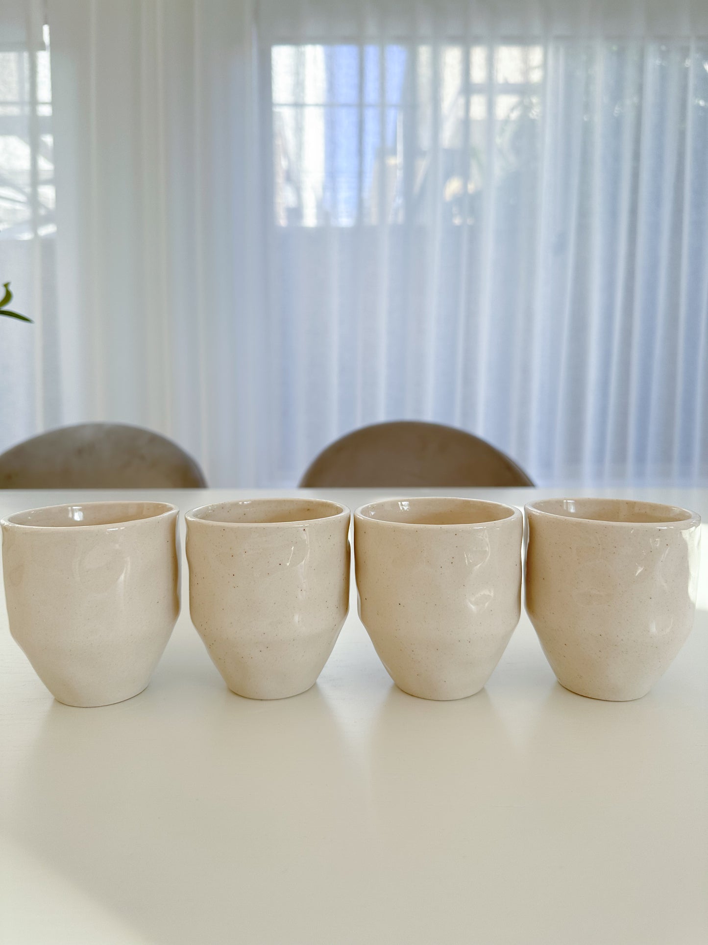 Coffee Cups featuring an organic wabi sabi design - set of 4 cups in the daylight