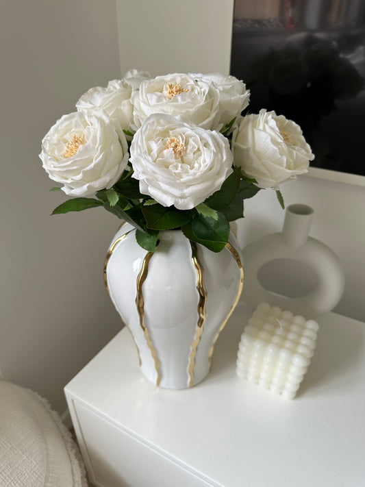 White Real Touch Peony Stems in White and Gold Striped Ceramic Vase from a top angled position close up