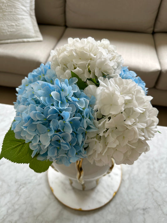 White and Blue Hamptons Style Silk and Real Touch Hydrangeas. On a white and gold vase from top view.