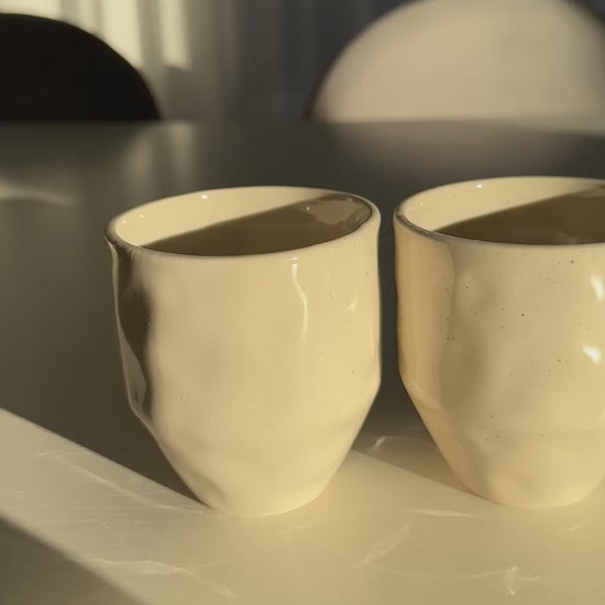 Video of organic wabi sabi coffee mugs set of 4 front view on dining table